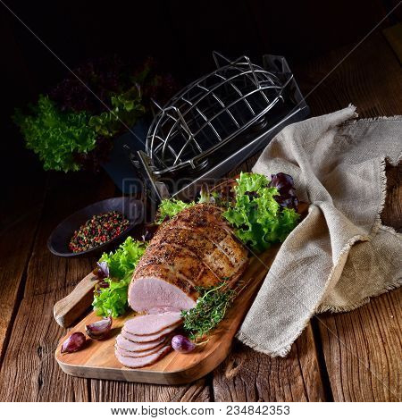 A Tasty Cooked Ham With Colorful Pfefer
