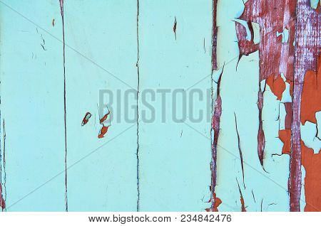 Wooden Background Painted Blue And Brown Color With Cracks And Scratches. Abstract Background.