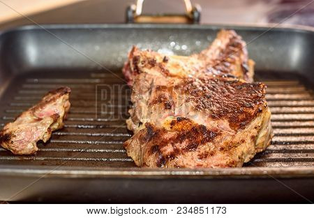 Large Piece Of Fresh Beef Meat Prepared On A Grill Pan. .