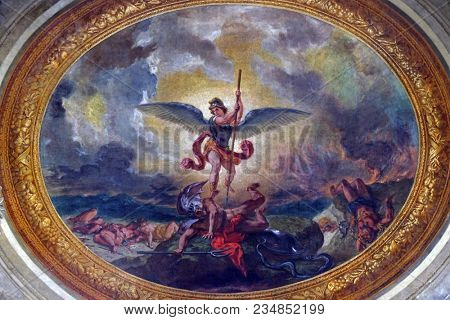 PARIS, FRANCE - JANUARY 04: Saint Michael slaying the dragon by Eugene Delacroix, painting on the ceiling of the Saint Sulpice Church, Paris, France on January 04, 2018.