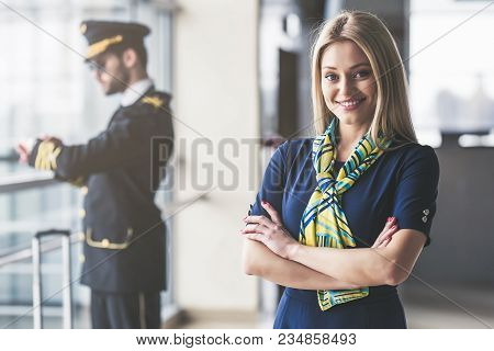 Pilot And Flight Attendant In Airport