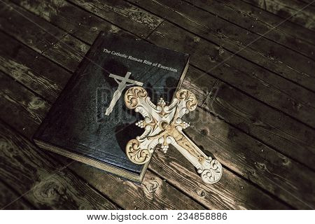 3d Illustration Of Exorcism Book On Wooden Floor