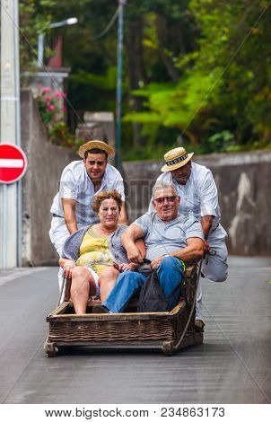 FUNCHAL, MADEIRA - SEPTEMBER 19: Traditional downhill sledge trip on September 19, 2016 in Madeira, Portugal.