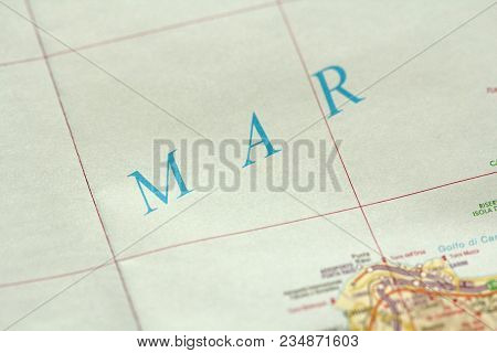 Mar. The Island Of Sicily, Italy. A Paper Map And Roads On The Map.