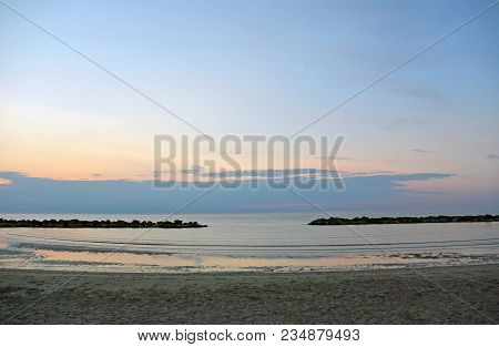 The Outfall On Sand Beach. Beautiful Sunrise Sky Over Adriatic Sea