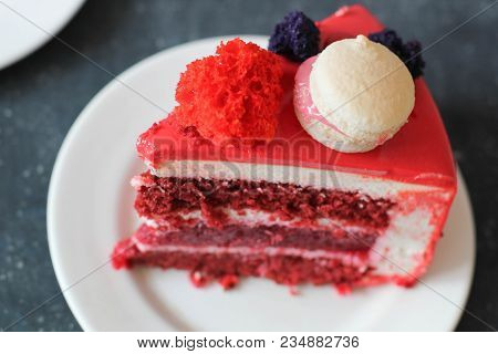 Red Velvet. Tasty Red Homemade Cake Decorated By Macarons. Modern Photo