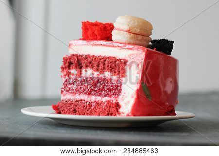 Red Velvet. Tasty Red Homemade Cake Decorated By Macarons. Modern Photo