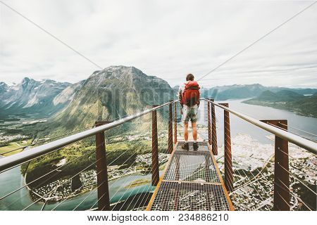Man Standing On Rampestreken Viewpoint Over Mountains Travel Lifestyle Adventure Vacations In Norway