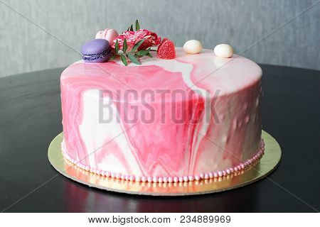 Tasty Pink Homemade Cake Decorated By Rose And Macarons. Marbelous Effect On Cake