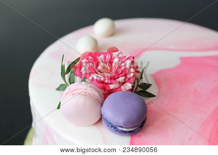 Tasty Pink Homemade Cake Decorated By Rose And Macarons. Marbelous Effect On Cake