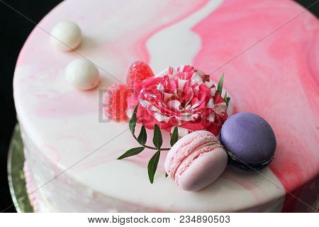 Tasty Pink Homemade Cake Decorated By Rose And Macarons. Marbelous Effect On Cake