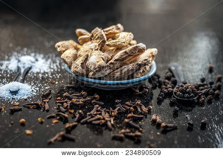 Close Up Of Ayurvedic Herb Or Folk Medicine Dried Ginger Or Zingiber Officinale With Black Pepper Co