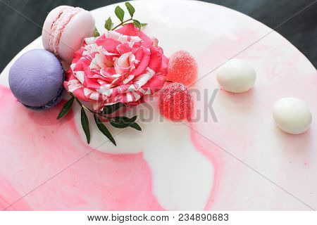 Tasty Pink Homemade Cake Decorated By Rose And Macarons. Marbelous Effect On Cake