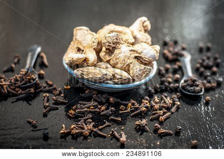 Close Up Of Ayurvedic Herb Or Folk Medicine Dried Ginger Or Zingiber Officinale With Black Pepper Co