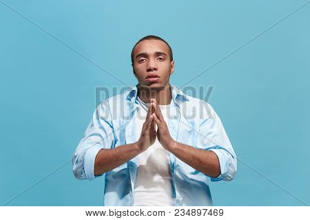 Serious Imploring Afro Standing, Looking At Camera Isolated On Trendy Blue Studio Background. Beauti