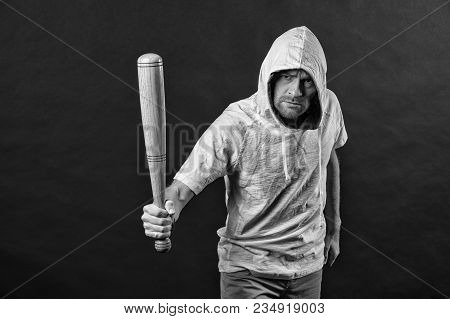 Gangster Guy Threaten With Bat Weapon. Man Hold Baseball Bat, Aggression. Hooligan Wear Hood In Hood