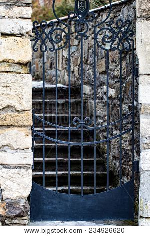 Stone Wall Entrance To A Garden, Security Closed Entrance Door.