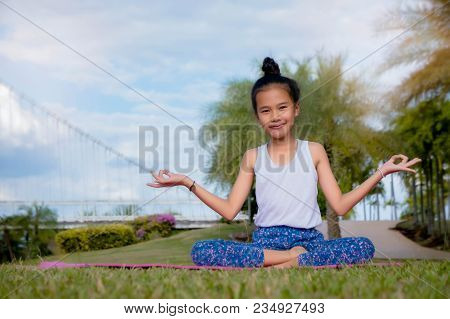 Healthy Yoga Girls And Concentrate In The Park , Kid Yoga Practice For Health In The Nice Day , Yoga