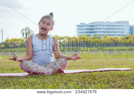 Healthy Yoga Girls And Concentrate In The Park , Kid Yoga Practice For Health In The Nice Day , Yoga