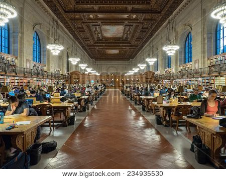 New York, Ny - December 10, 2017: A Wideview Of Patrons Studying On Books And Laptops In The Rose Ma