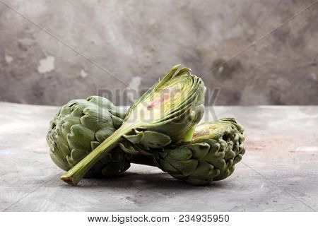 Artichokes On Grey Background. Fresh Organic Artichoke Flower.