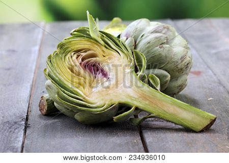 Artichokes On Grey Background. Fresh Organic Artichoke Flower.