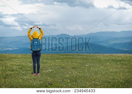 Girl Holding A Heart - Shape In The Nature.