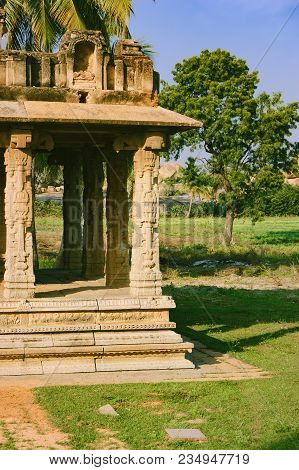 Ancient Ruins Of Gejjala Mandapa In Hampi, Karnataka, India. Gejjala Mandapa Is Located At The Left 