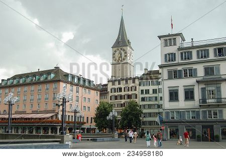 The Famous Clock And Tower Of The St Peter Church (kirche) Photographed From The Town Hall Bridge (r