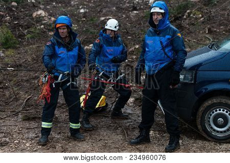 Rescue Man Helping Out On Land With Rope