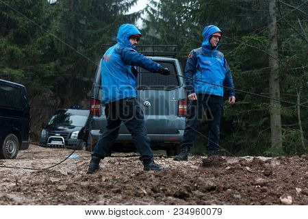 Rescue Man Helping Out On Land With Rope