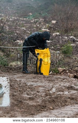 Rescue Man Helping Out On Land With Rope