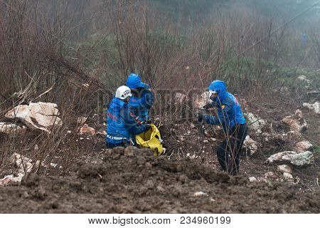 Rescue Man Helping Out On Land With Rope