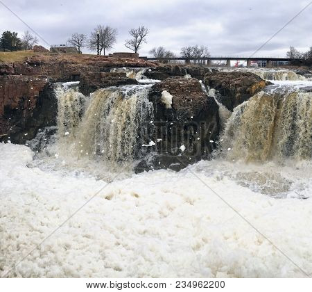The Big Sioux River Flows Over Rocks In Sioux Falls South Dakota With Views Of Wildlife, Ruins, Park