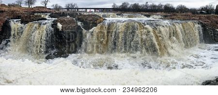 The Big Sioux River Flows Over Rocks In Sioux Falls South Dakota With Views Of Wildlife, Ruins, Park