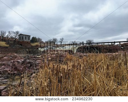 The Big Sioux River Flows Over Rocks In Sioux Falls South Dakota With Views Of Wildlife, Ruins, Park