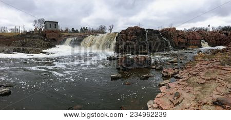 The Big Sioux River Flows Over Rocks In Sioux Falls South Dakota With Views Of Wildlife, Ruins, Park