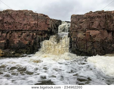 The Big Sioux River Flows Over Rocks In Sioux Falls South Dakota With Views Of Wildlife, Ruins, Park