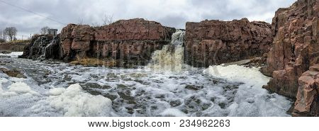 The Big Sioux River Flows Over Rocks In Sioux Falls South Dakota With Views Of Wildlife, Ruins, Park