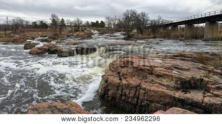 The Big Sioux River Flows Over Rocks In Sioux Falls South Dakota With Views Of Wildlife, Ruins, Park