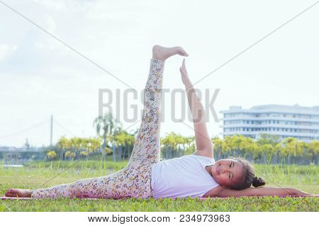 Healthy Yoga Girls And Concentrate In The Park , Kid Yoga Practice For Health In The Nice Day , Yoga