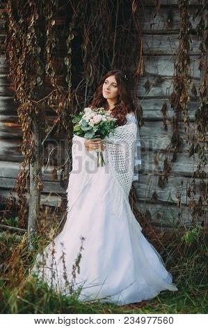 Stylish Beautiful Bride With Wedding Bouquet In Nature
