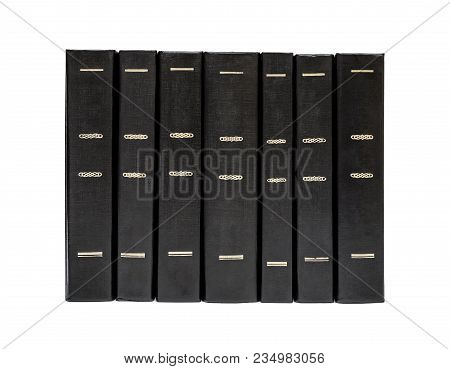 Row Of Black Books Isolated On White.