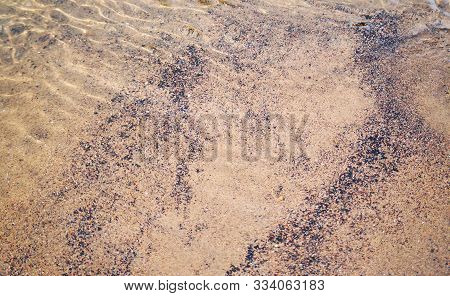 View of the pebbles at the bottom through the rapid flow of the river