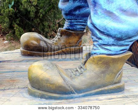 Man With The Golden Boots In Yantai China.