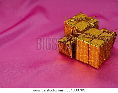 Christmas Tree On A Background Of Shiny Pink Satin As Background, Silk Background, Christmas Card. H