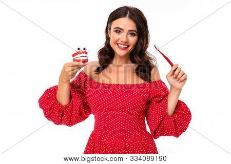 Beeautiful Young Woman With Perfect Smile Advises Regulary Brush Teeth.