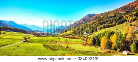 Magnificent Autumn View Of St.valentin Village And Haidersee (lago Della Muta) Lake With Ortler Peak