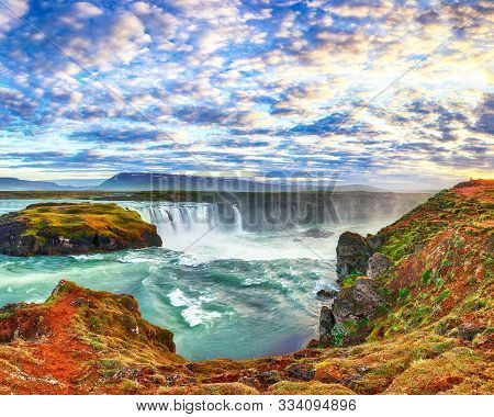 Fantastic Sunset Scene Of Powerful Godafoss Waterfall. Dramatic Sky Over Godafoss. Location: Bardard