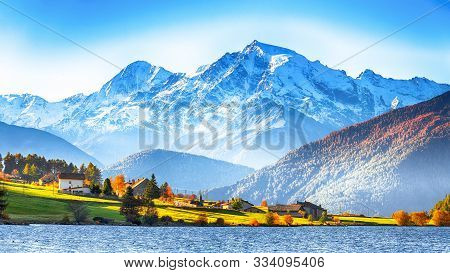 Splendid Autumn Panorama Of Haidersee (lago Della Muta) Lake With Ortler Peak On Background.
Locatio